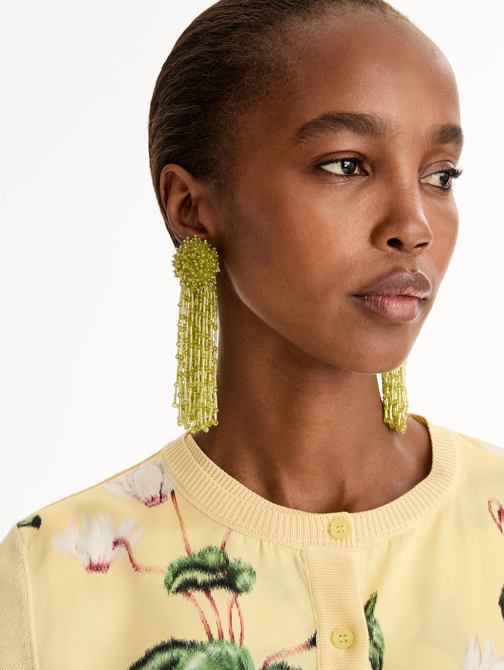 Green Beaded Tassel Drop Clip-On Earrings with beaded cluster stud and cascading beaded tassels. Front View. 