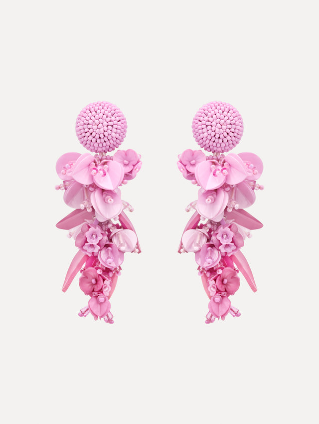 Pink Cascading Petal Drop Clip-On Earrings featuring a round beaded stud at the lobe with cascading clusters of glossy pink petals, beads, and floral-shaped components that create a layered, sculptural drop. Front View.