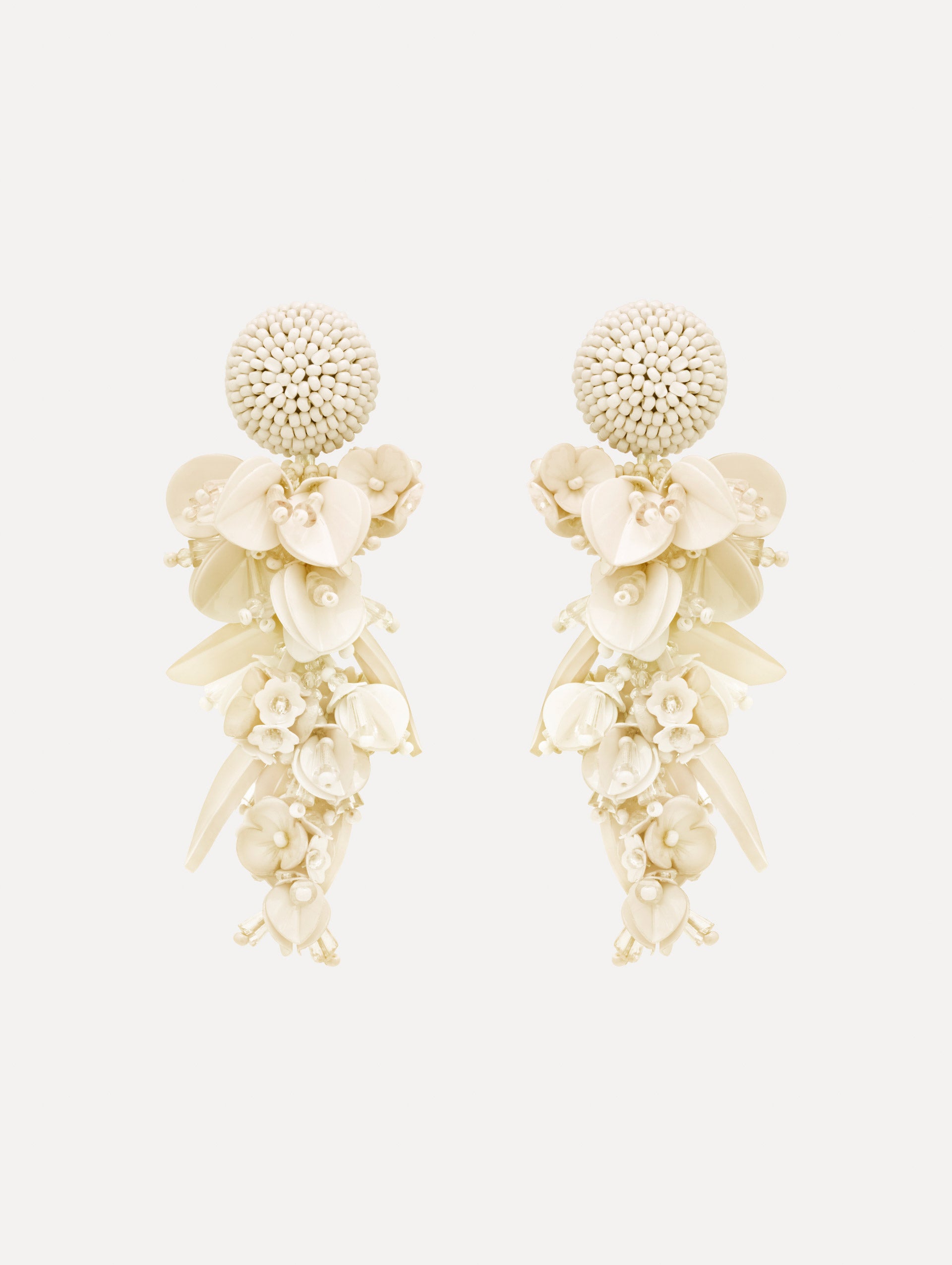 White Cascading Petal Drop Clip-On Earrings featuring a round beaded stud at the lobe with cascading clusters of glossy pink petals, beads, and floral-shaped components. Front View.