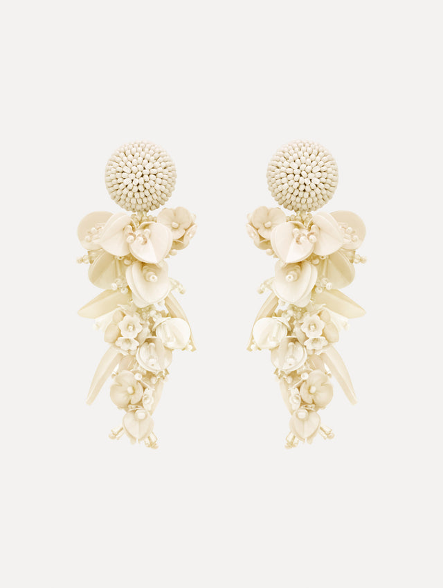 White Cascading Petal Drop Clip-On Earrings featuring a round beaded stud at the lobe with cascading clusters of glossy pink petals, beads, and floral-shaped components. Front View.