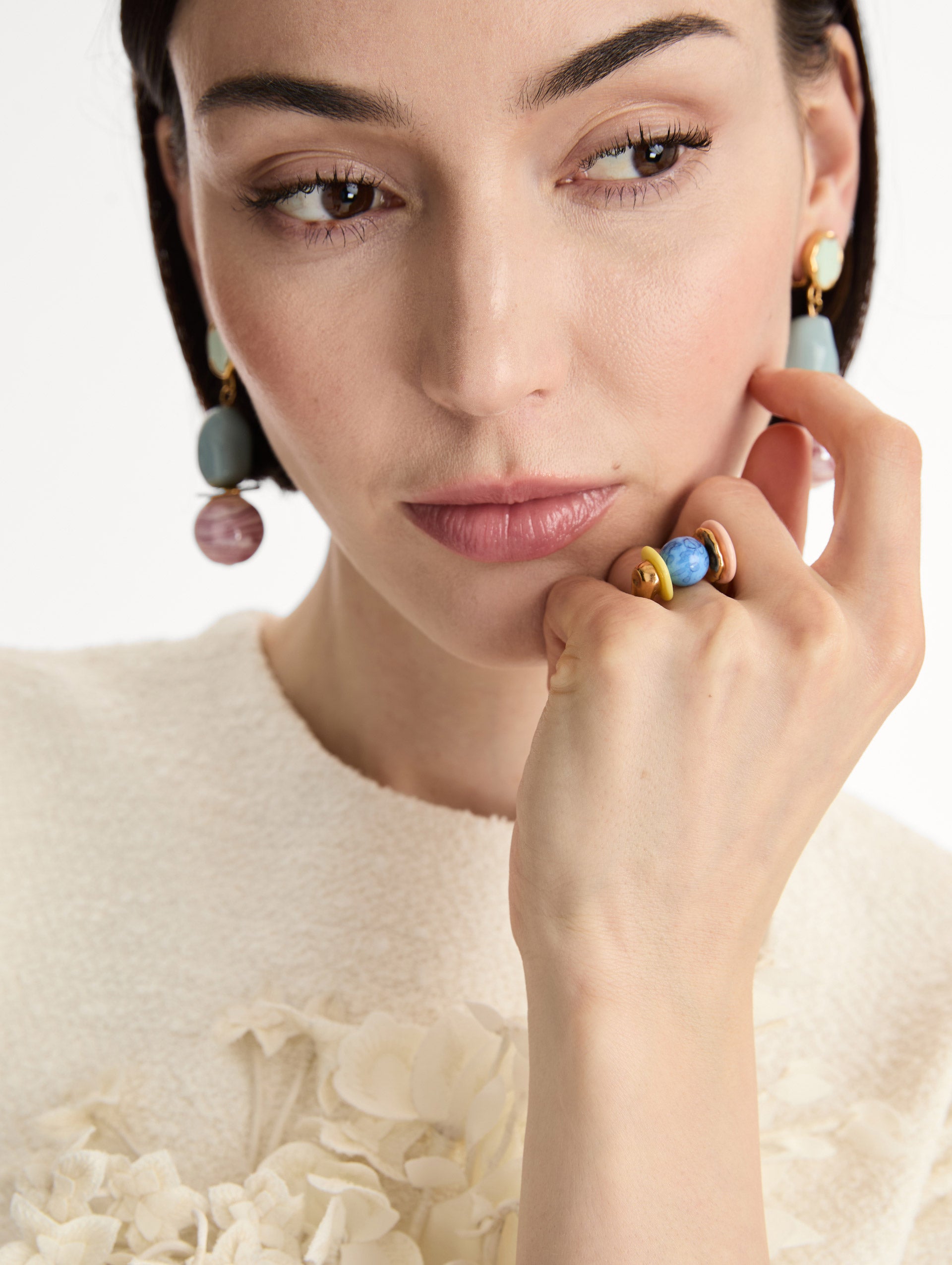 Gold Sea Glass Ring featuring a central marbled blue bead flanked by rounded pastel elements in yellow and blush pink. Front View.