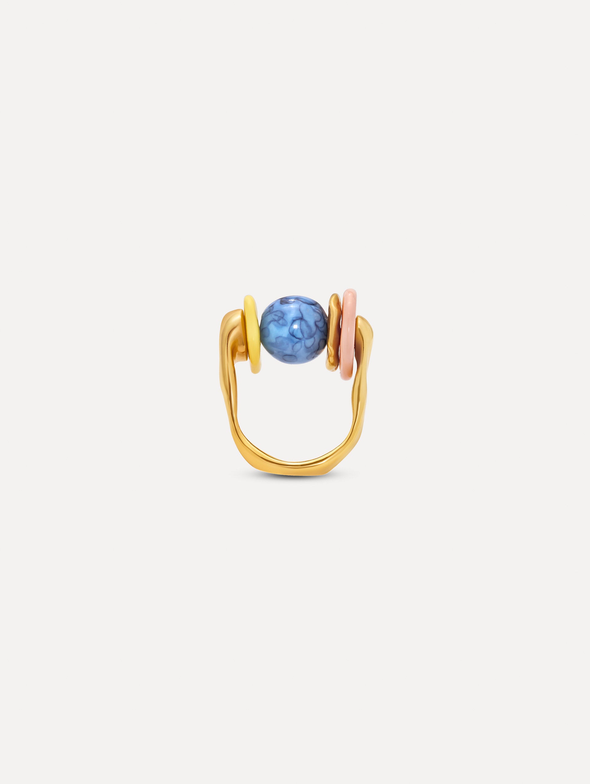 Gold Sea Glass Ring featuring a central marbled blue bead flanked by rounded pastel elements in yellow and blush pink. Front View.
