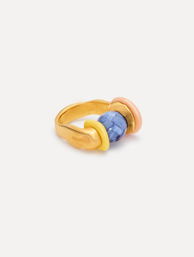 Gold Sea Glass Ring featuring a central marbled blue bead flanked by rounded pastel elements in yellow and blush pink. Side View.