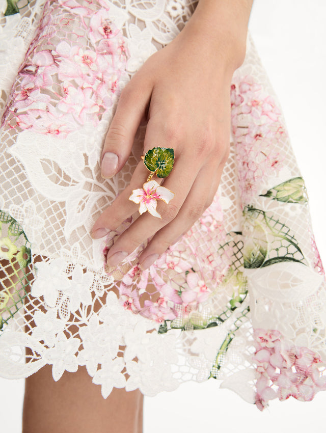 Gold Enamel Cyclamen Ring with a green leaf and a pink and white flower. Front View.
