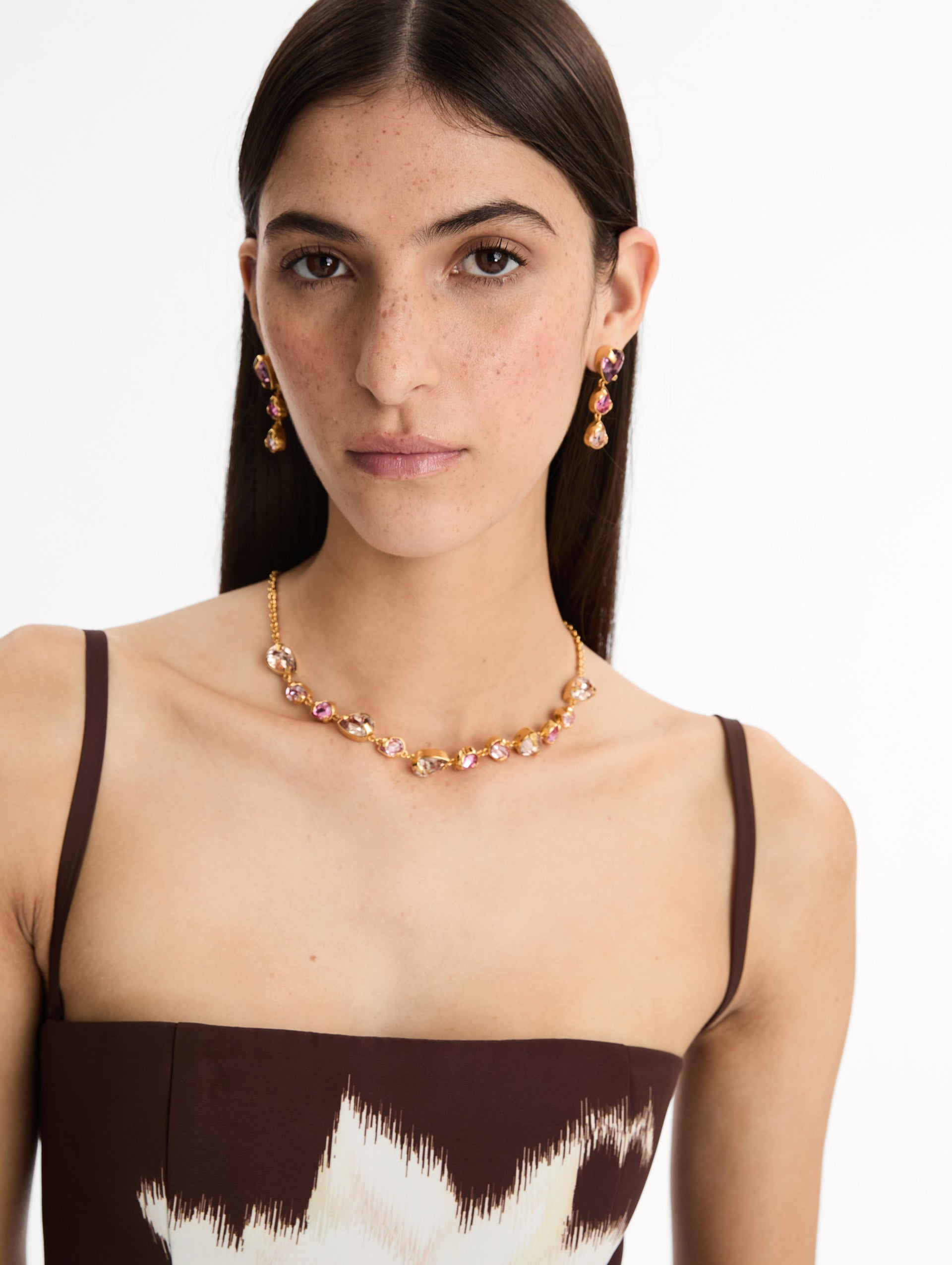 Gold Pear-Cut Cluster Necklace with pink and Lilac crystals. Front View.