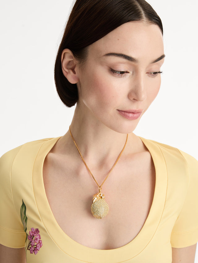 Gold Pavé Pear Pendant Necklace encrusted with clear crystals and a lobster clasp. Front View.