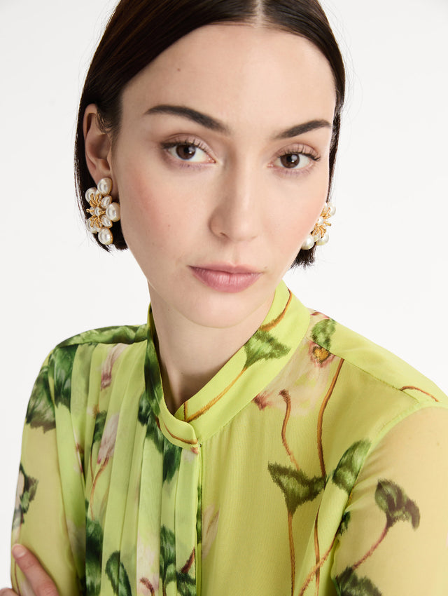 white Large Pearl Flower Clip-On Earrings with pearls in a flower shape and a gold setting. Front View.