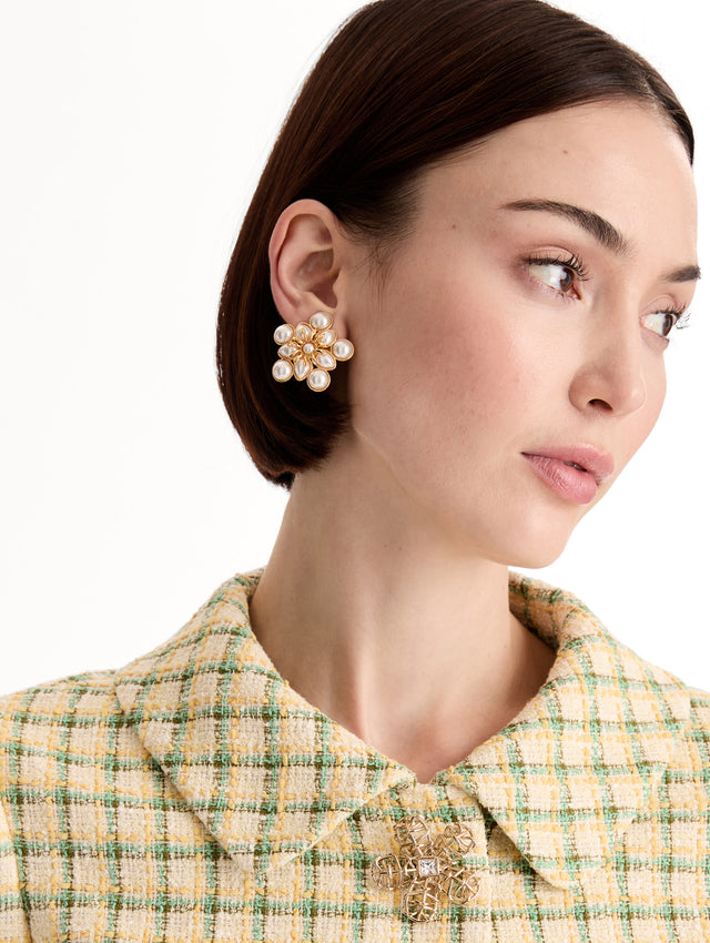 white Small Pearl Flower Clip-On Earrings with pearls in a flower shape with gold setting. Front View.