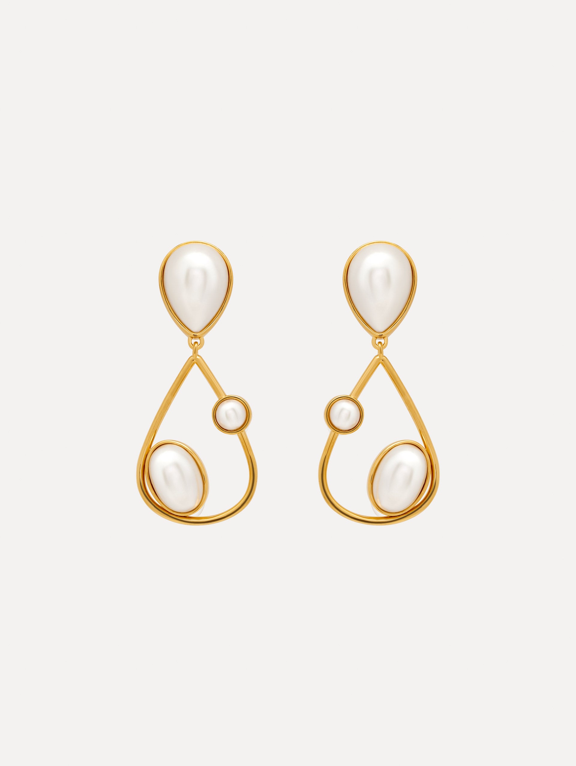 Pearl Cabochon Drop Clip-On Earrings with three pearls and a gold pear shaped drop. Front View.
