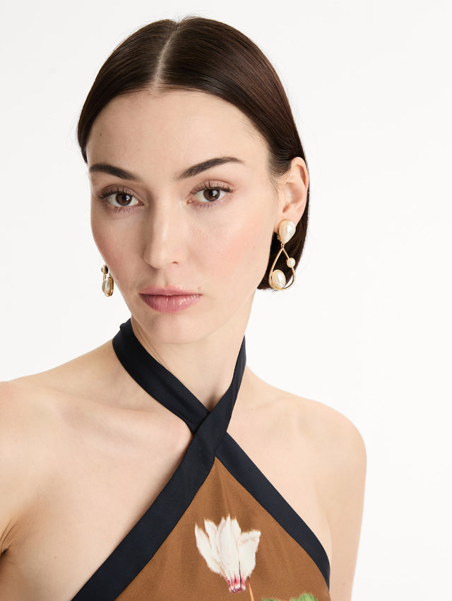 Pearl Cabochon Drop Clip-On Earrings with three pearls and a gold pear shaped drop. Front View.