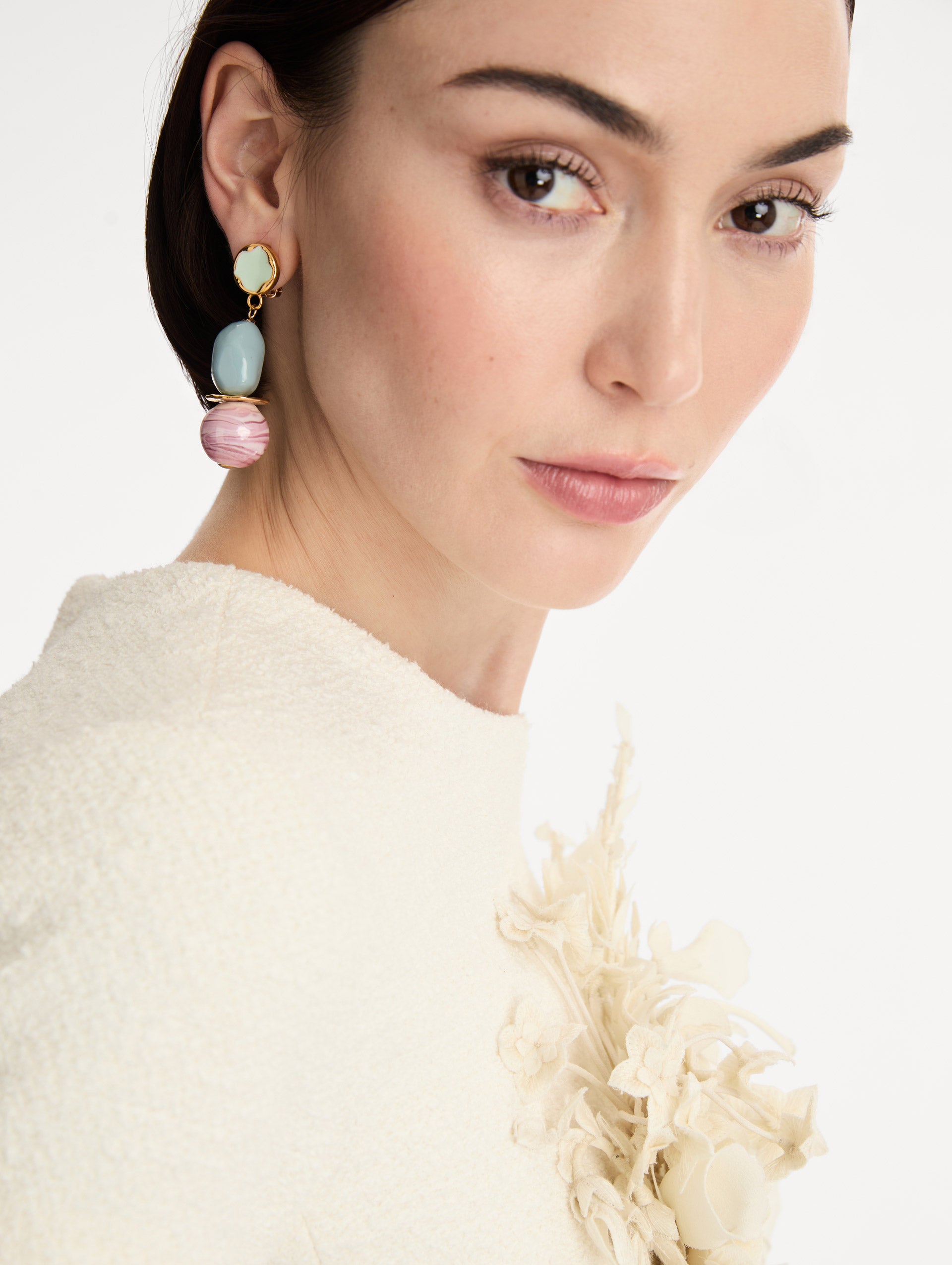 Gold Sea Glass Drop Clip-On Earrings with green studs, stacked blue beads, and marbled pink orb pendants. Front View.