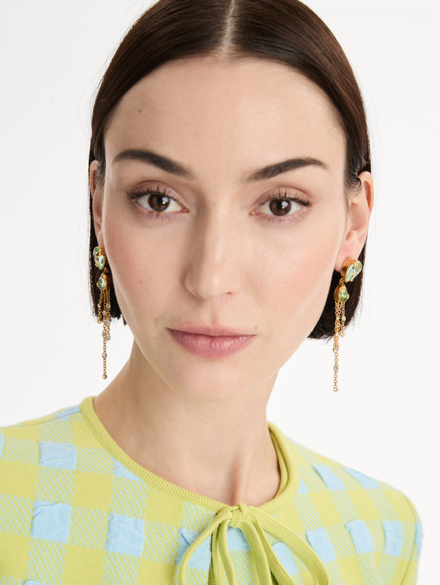 Green Pear-Cut Chandelier Earrings with teardrop crystals and gold chains cascading. Front View. 