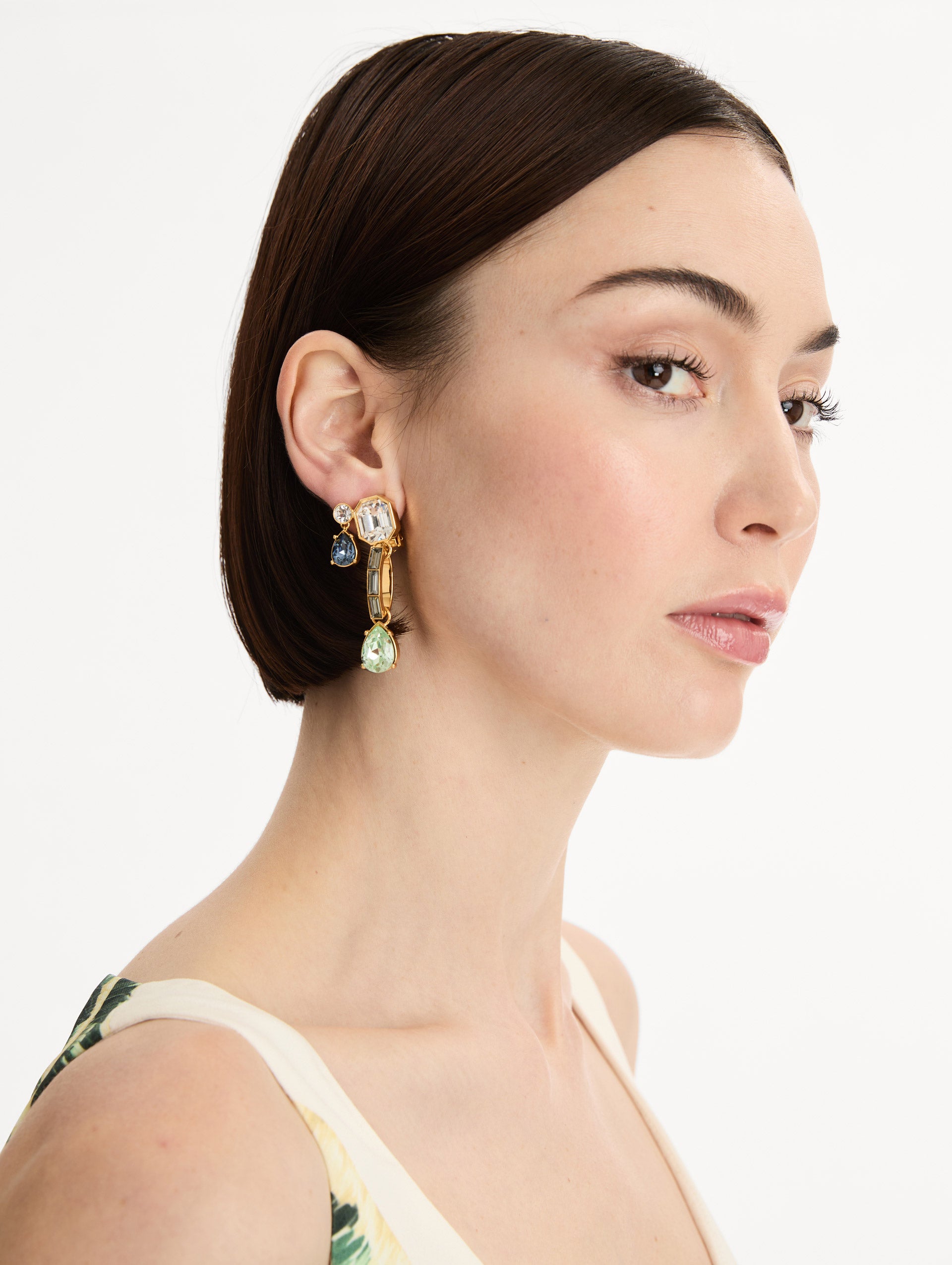Blue and Green Mixed-Stone Linear Drop Earrings with square clear stone and cascading circular and teardrop stones. Front View.