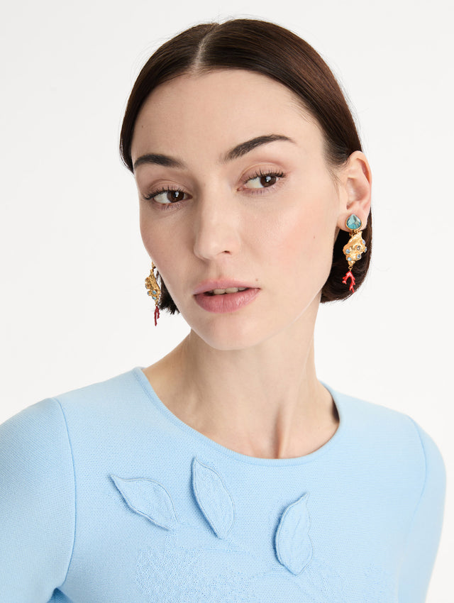 Gold Mixed Seashell Drop Clip-On Earrings with blue crystal accents, asymmetrical gemstone tops, and red coral-inspired dangle details. Front View.