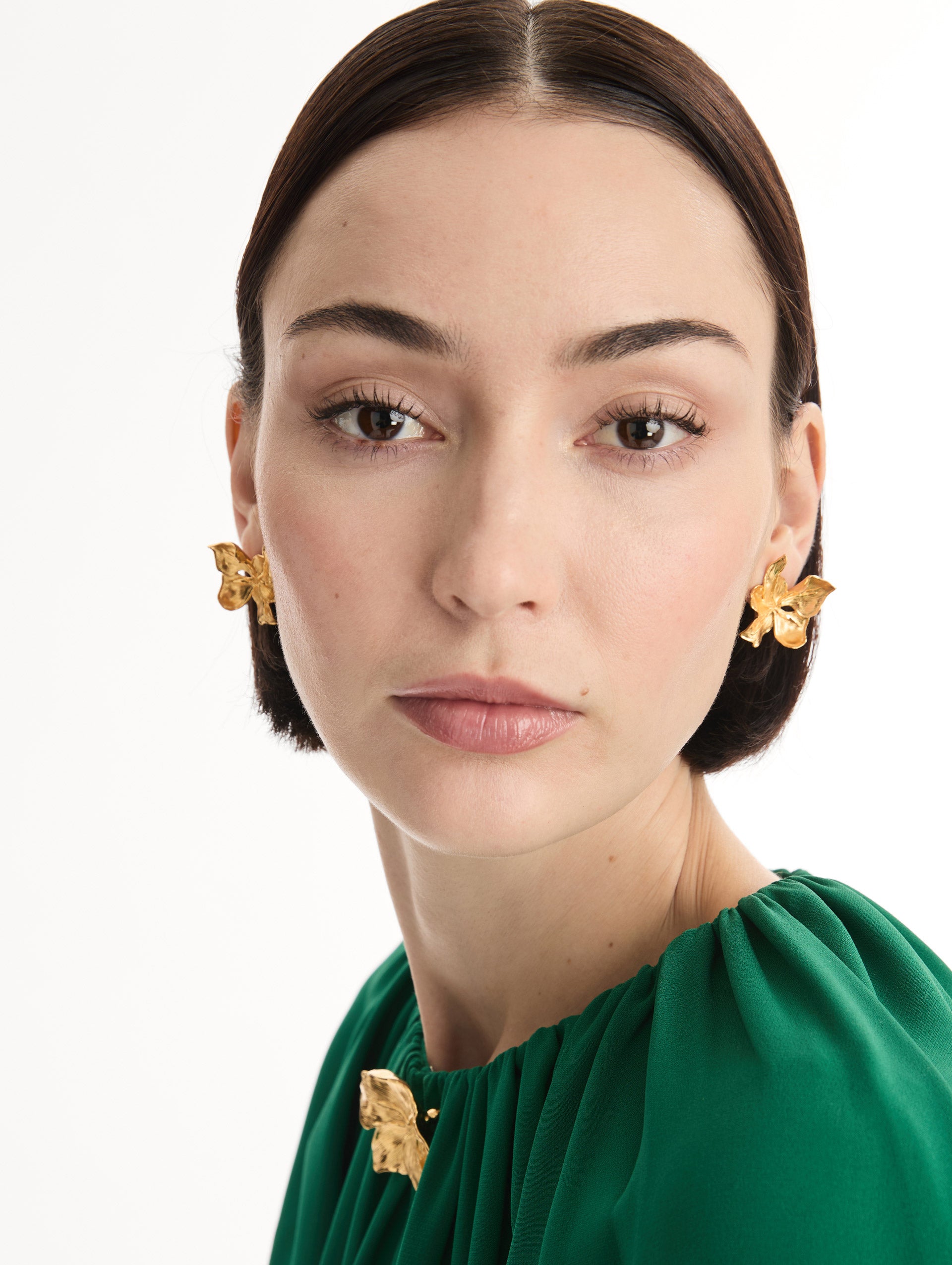 Gold Cyclamen Earrings with sculpted petal detailing. Front View.