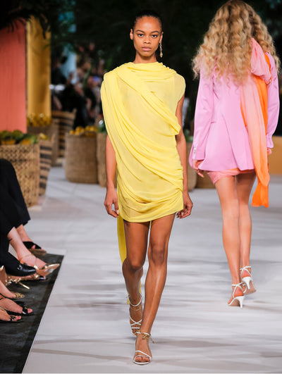 A model wears a yellow dress
