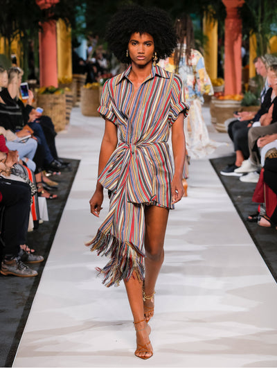 A model wears a striped romper