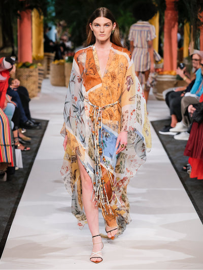 A model wears a floral printed caftan