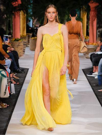 A model wears a yellow tulle gown