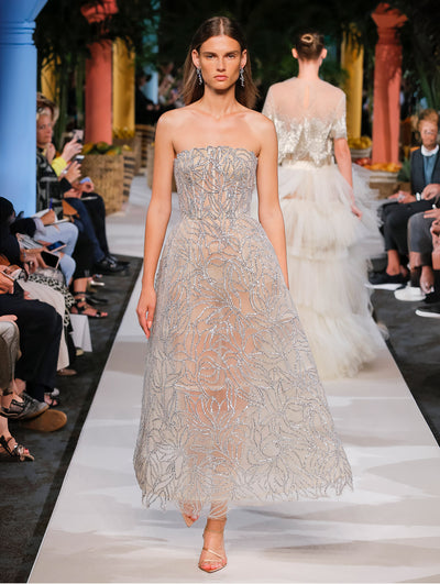 A model wears a crystal embroidered dress