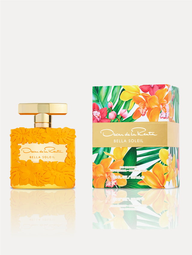 Bella Soleil Fragrance. Bottle is orange with floral motifs, gold spray. Box depicts florals. Front view.