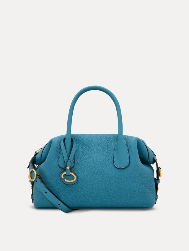 The Mini Dahlia in Blue. This mini duffle bag has top handles and a removable shoulder strap. Detailed with Oscar de la Renta signature O emblem on the hangtag. Front View